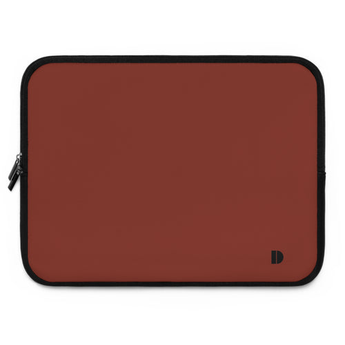 A rectangular laptop sleeve in a solid reddish-brown color with black trim and a small black logo in the bottom right corner, shown on a plain white background.