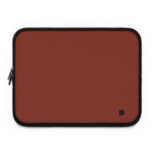 A rectangular laptop sleeve in a muted terracotta red color with black trim and a small black monogram logo in the bottom right corner, shown on a plain white background.