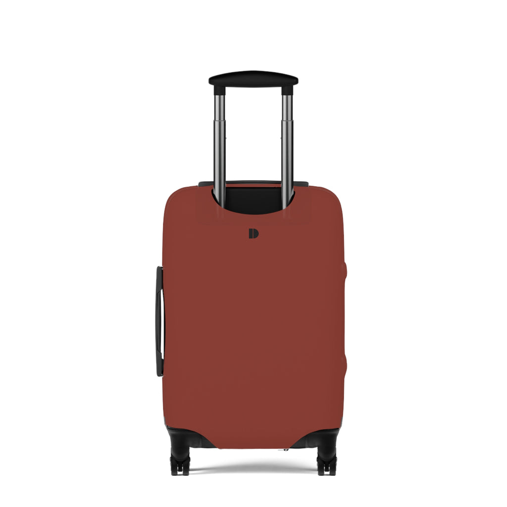 A hard-shell suitcase fitted with a  protective cover in a muted terracotta or rust red color. The cover features a small black monogram logo near the top center.