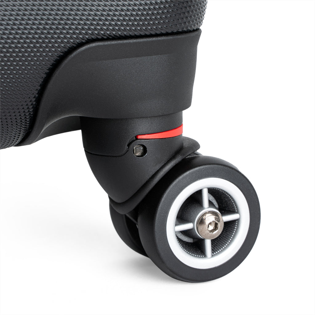 Close-up of a suitcase wheel on a white background