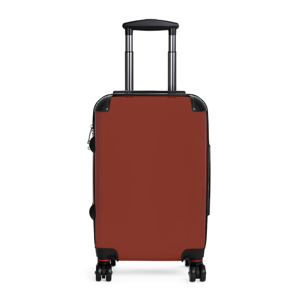 A hard-shell hardside suitcase in a brick red color, featuring a telescoping handle extended upwards and four spinner wheels, shown against a plain white background.
