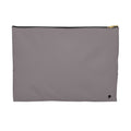 A minimalist rectangular zippered pouch in a muted gray, featuring a black zipper and a small black logo on the bottom right corner, set against a plain white background.