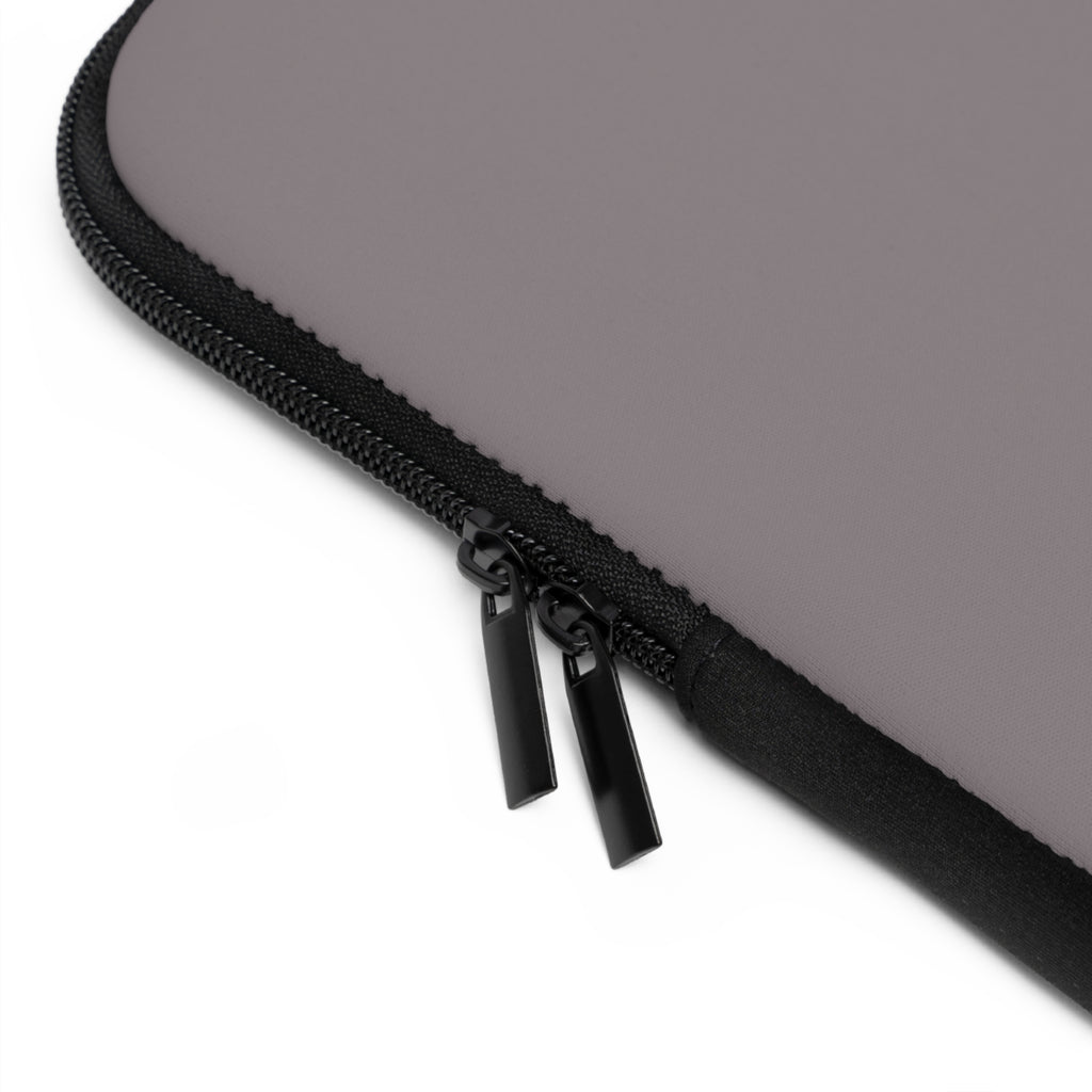 Close-up of a black zipper on a gray laptop sleeve