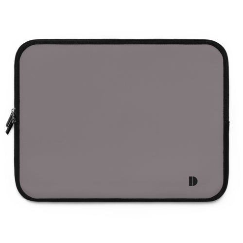 A rectangular laptop sleeve in a muted gray color with a black zipper border and a small black logo in the bottom right corner, shown on a plain white background.