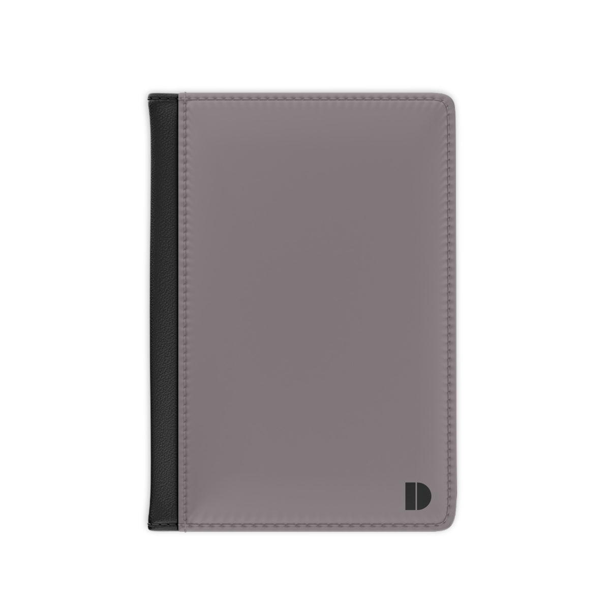 A minimalist passport cover or document holder in a muted grayi with a black spine band and a small black monogram logo in the bottom right corner, shown on a plain white background.