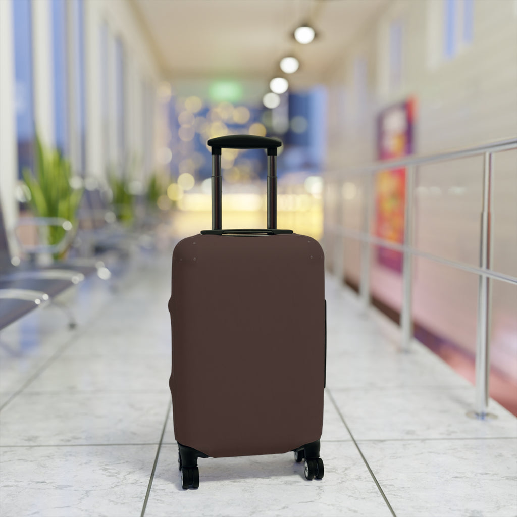 A brown protective luggage cover fitted on a rolling suitcase, set in a blurred airport terminal hallway.