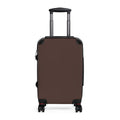 Small brown suitcase with extended telesoping handle and spinner wheels on a white background