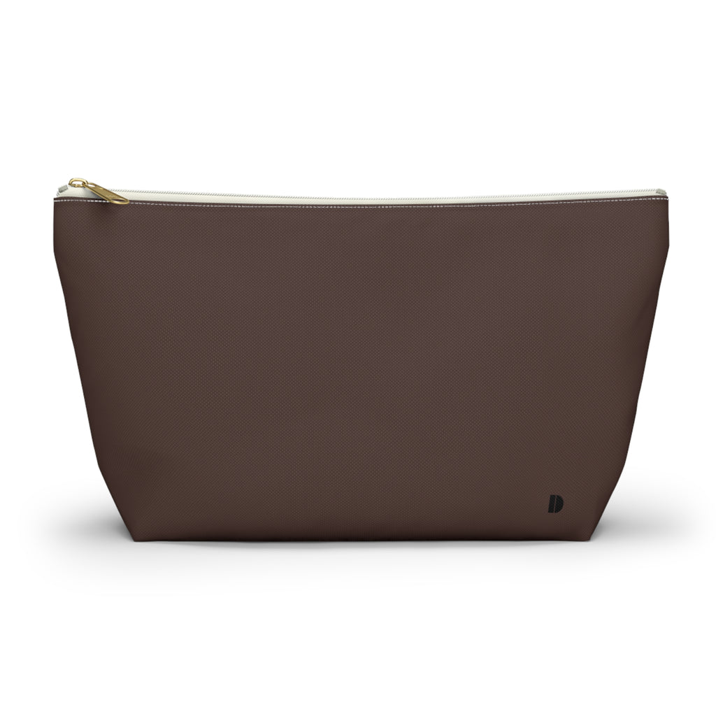 A dark brown waterproof pouch with a gold zipper and a small black monogram logo on the bottom right, shown against a plain white background.