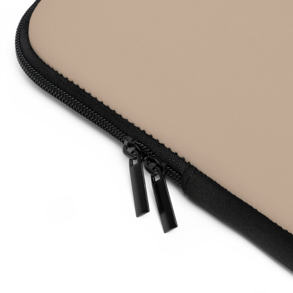 Close-up of a beige neoprene laptop sleeve with a black zipper and dual black zipper pulls, shown on a white background.