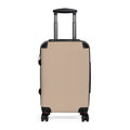 A hard-shell carry-on suitcase in a warm beige/tan color with black trim, a telescoping handle, and dual spinner wheels, shown from the front on a plain white background.