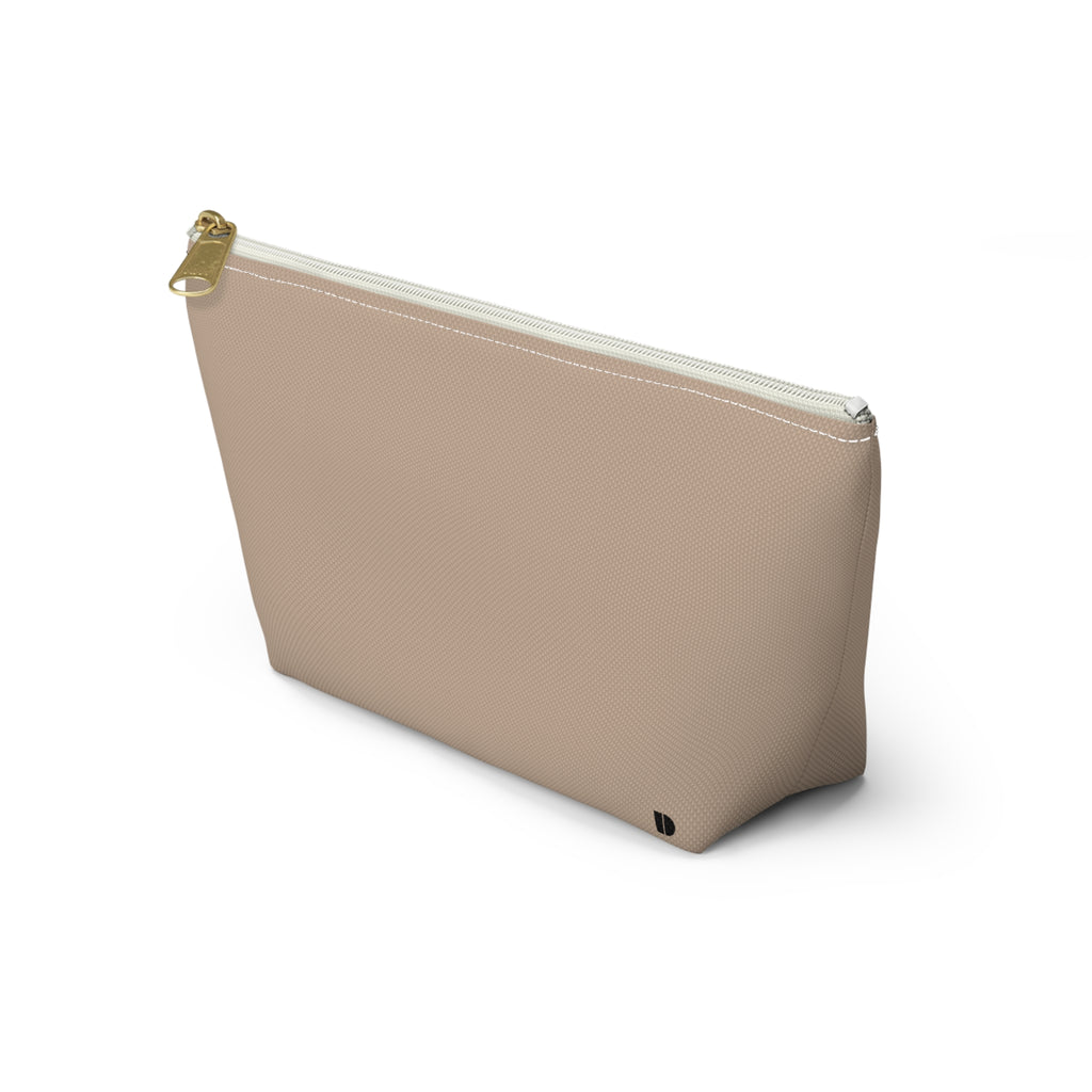 A beige zippered pouch with a small black monogram logo on the bottom right corner, photographed on a clean white background.