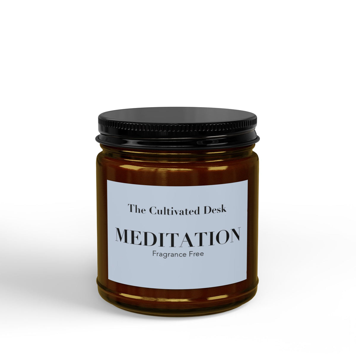 Fragrance-free scented candle in a 4oz amber glass jar featuring a minimalist light blue label with the text "The Cultivated Desk," "MEDITATION," and "Fragrance Free" in black serif typography, sealed with a ribbed black metal lid. Scented candle titled 'Meditation', available in 9oz and 4oz sizes.