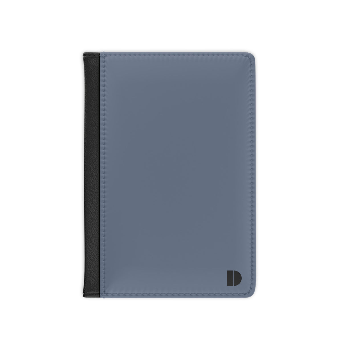 A minimalist card holder or passport cover in a muted slate blue color with a black vertical accent strip on the left edge and a small black monogram logo in the bottom right corner, shown on a plain white background.