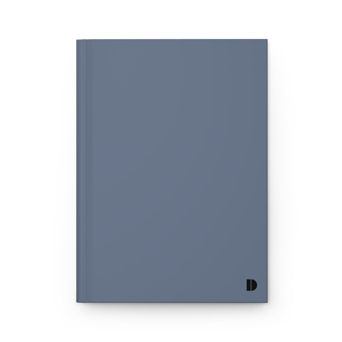 A minimalist hardcover notebook in a muted slate blue color, featuring a small black monogram 'D' logo in the bottom right corner, set against a clean white background.