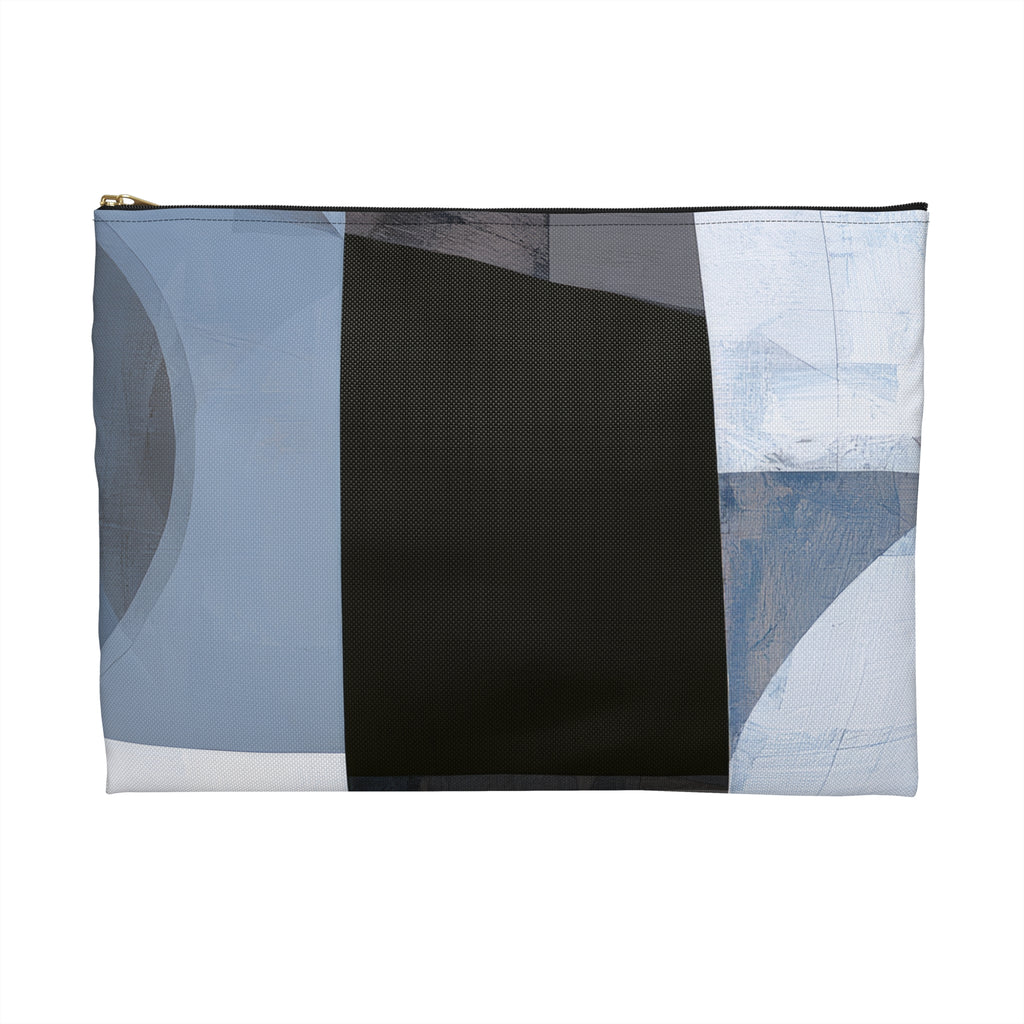 A rectangular zippered pouch with an abstract geometric print in shades of blue, black, gray, and white, featuring a gold zipper pull on a plain white background.