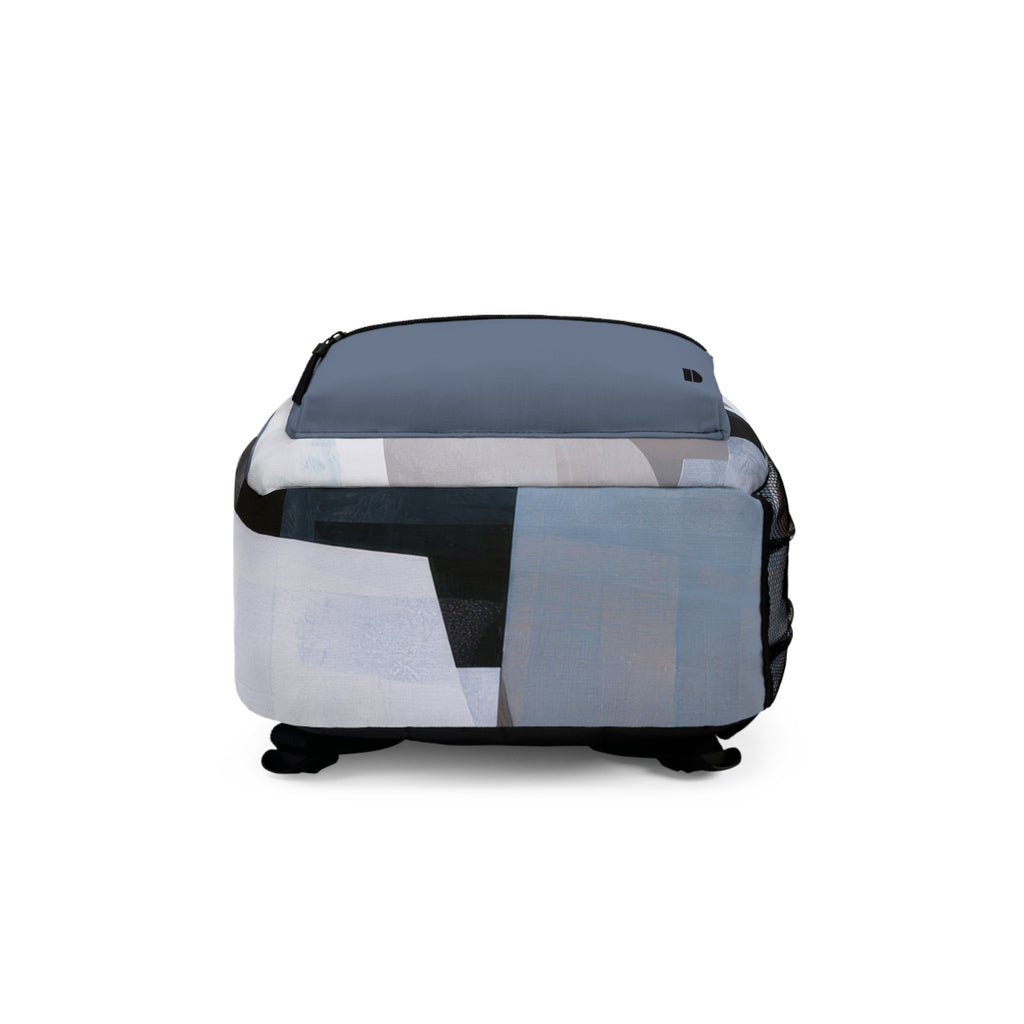 Bottom view of a backpack with an abstract geometric print in shades of blue, gray, white, and black, shown on a plain white background.