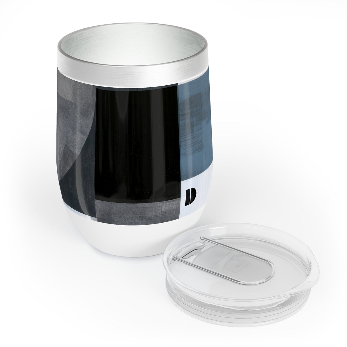 A stainless steel insulated tumbler with a clear lid, featuring a modern abstract geometric pattern in black, gray, and slate blue. The tumbler is shown on a clean white background with its clear lid placed in front.