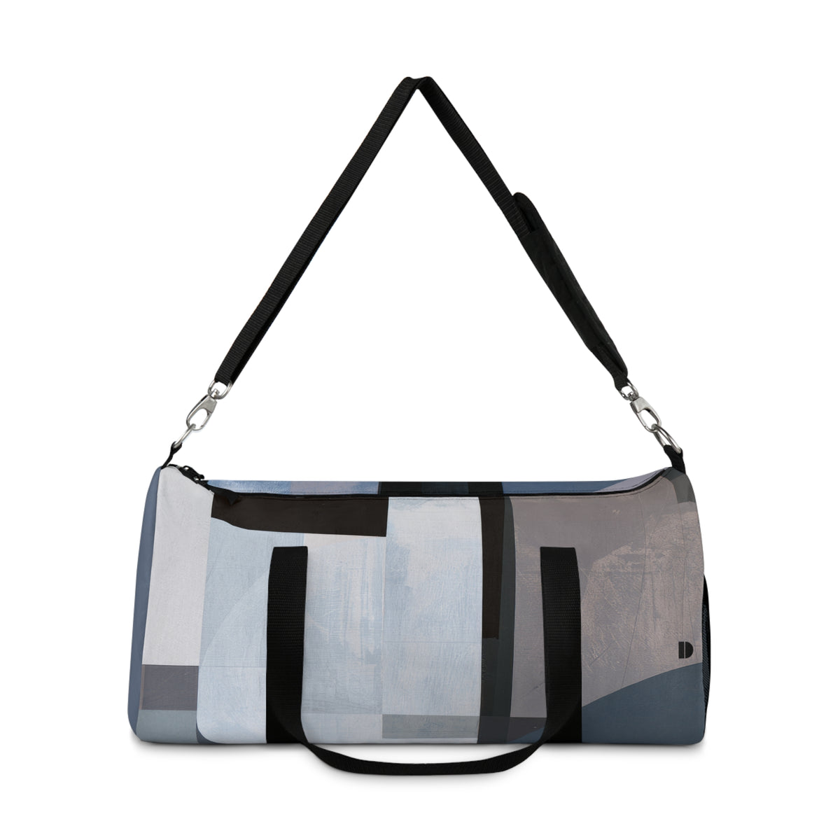 A duffle bag with an abstract geometric pattern in shades of blue, gray, black, and white, featuring a black shoulder strap and a short black handle, shown against a plain white background.