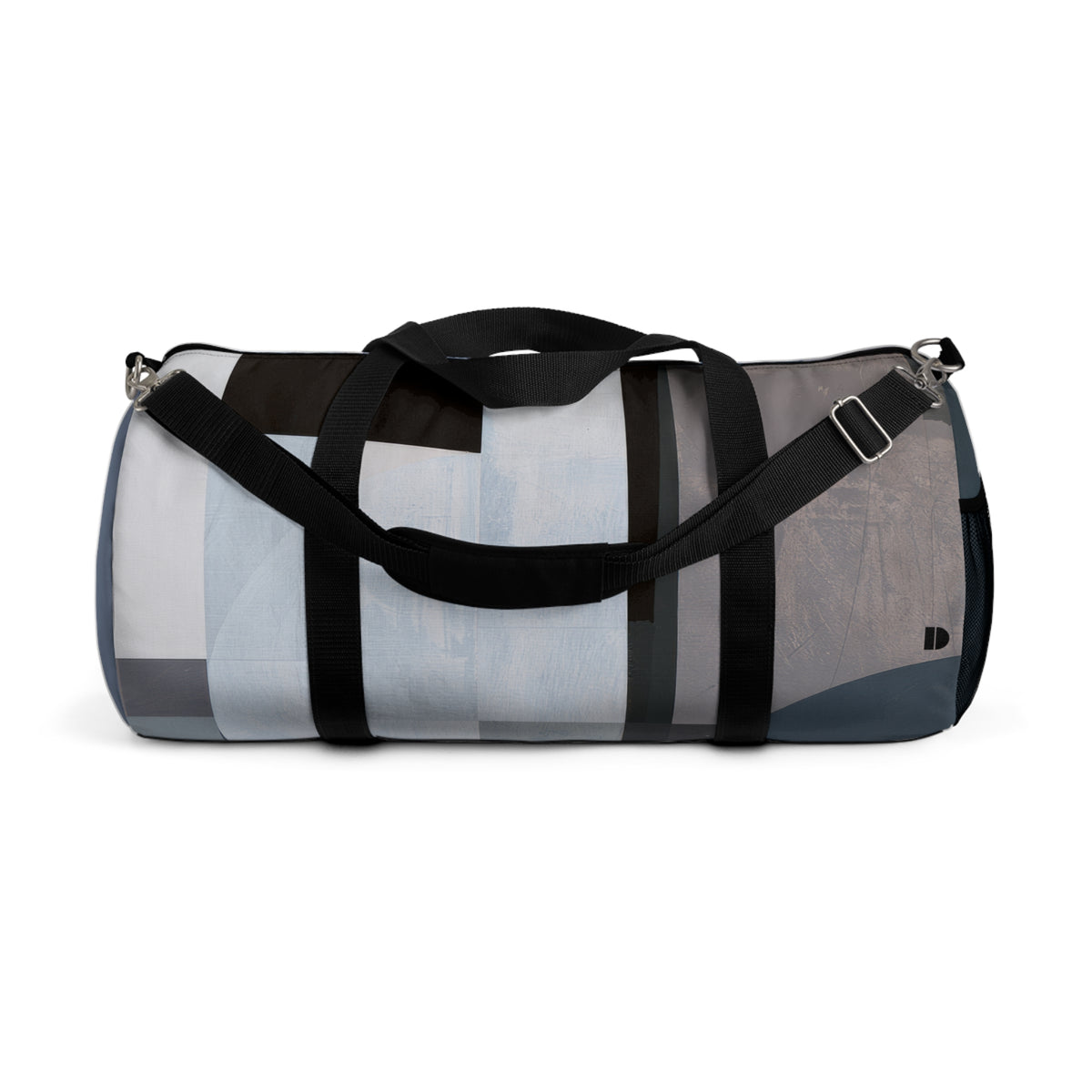 A cylindrical duffel bag with a modern abstract geometric pattern in shades of gray, blue, white, and black, featuring black webbing handles and a shoulder strap with silver metal hardware, shown against a plain white background.