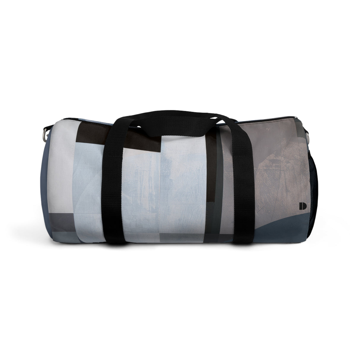 A cylindrical duffel bag with a modern abstract geometric pattern in shades of gray, blue, white, and black, featuring black webbing handles and a shoulder strap with silver metal hardware, shown against a plain white background.