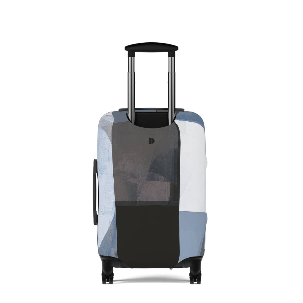 A hard-shell rolling suitcase with an extended telescoping handle and four wheels, covered in a geometric patchwork luggage sleeve featuring shades of blue, gray, black, and white.