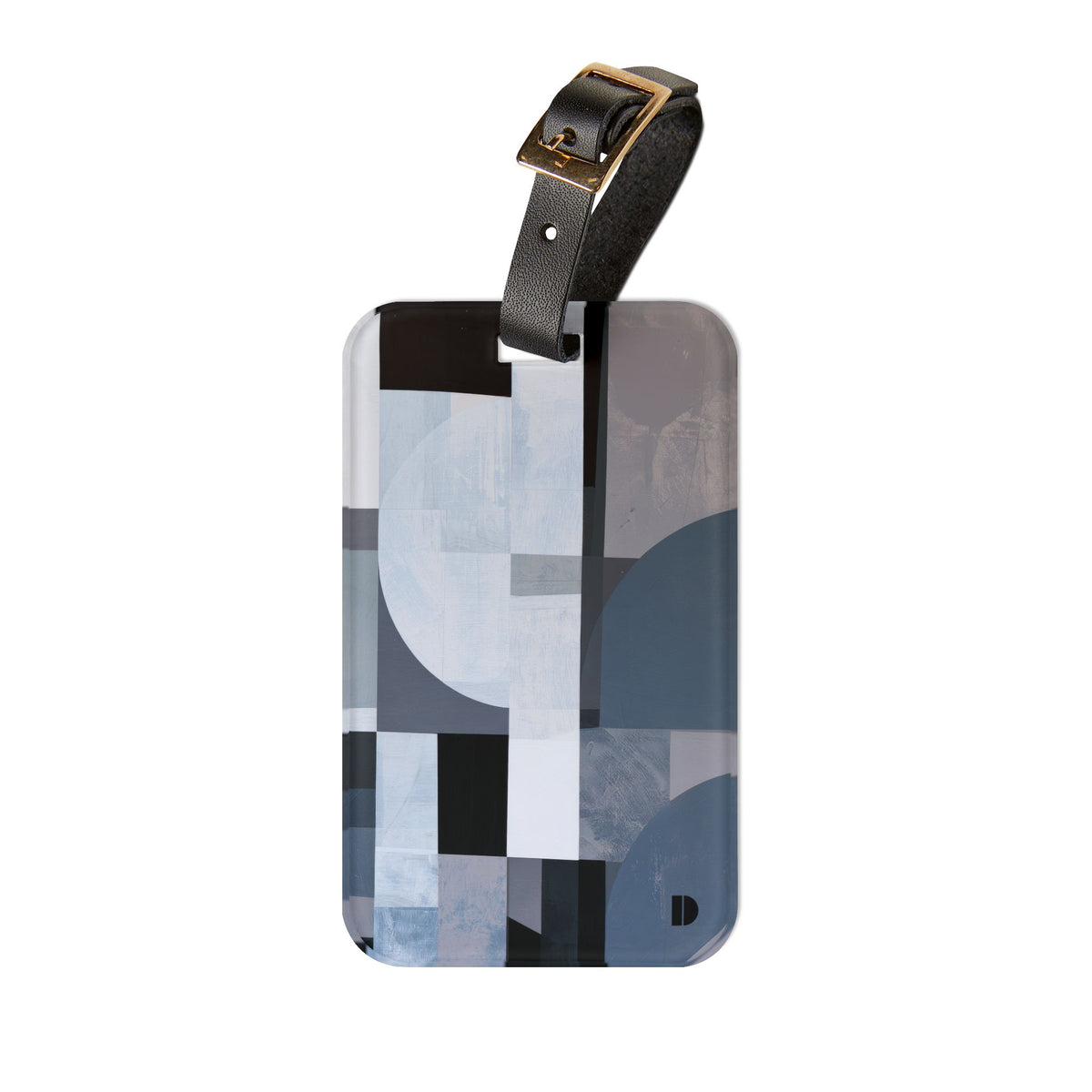 A rectangular luggage tag with rounded corners featuring an abstract geometric pattern in shades of gray, blue, black, and white. It is equipped with a black leather strap and a gold-tone metal buckle, shown against a plain white background.