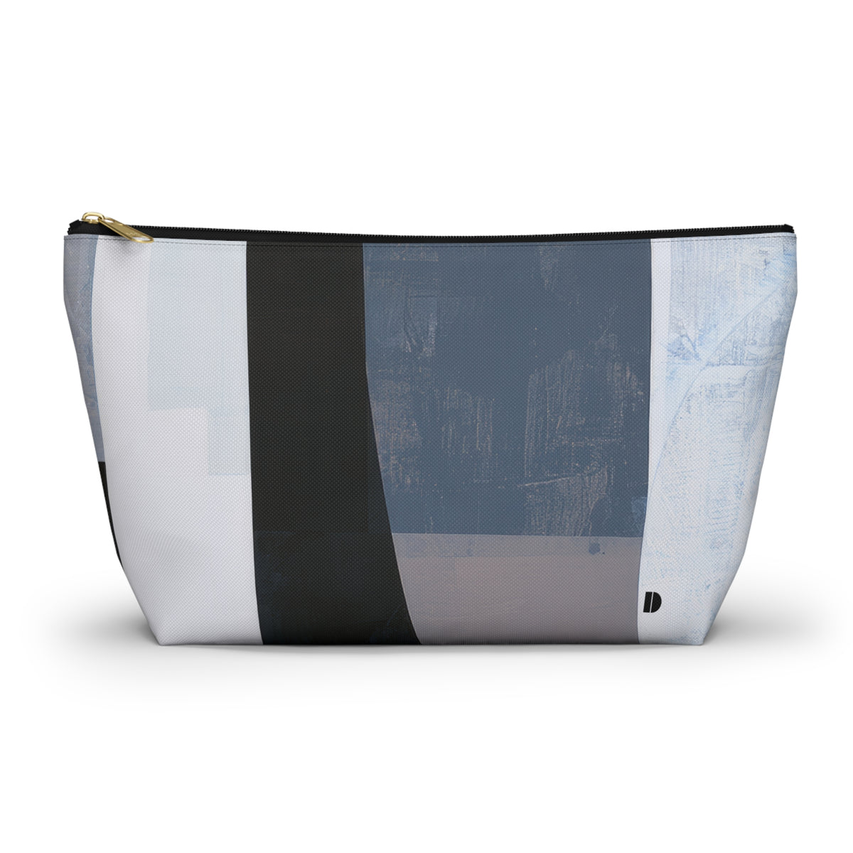 A rectangular zippered pouch with an abstract geometric patchwork pattern in shades of blue, gray, white, and charcoal, featuring a gold zipper pull and a small black logo on the bottom right.