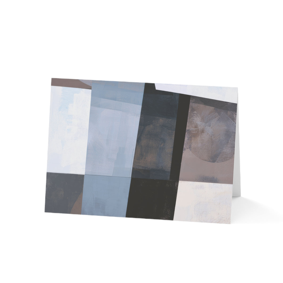 An abstract art gratitude card featuring a modern geometric design with blocks of light blue, gray, black, beige, and white, shown standing upright on a white background.
