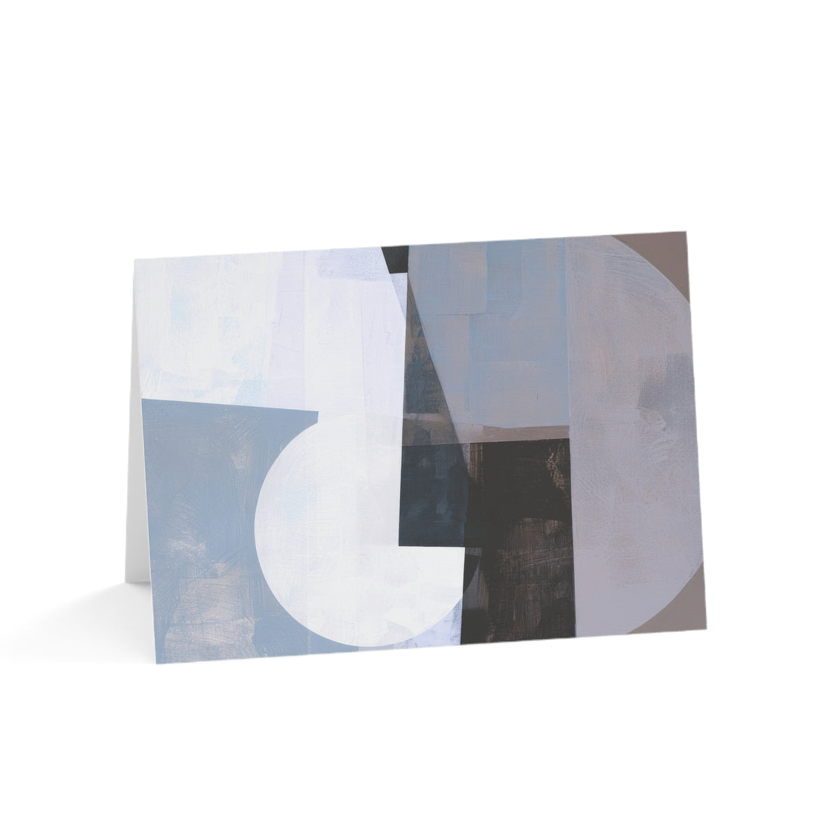 An abstract art gratitude card featuring a modern geometric design with overlapping circles, rectangles, and textured blocks in shades of blue, white, gray, and black, displayed standing upright on a white background.