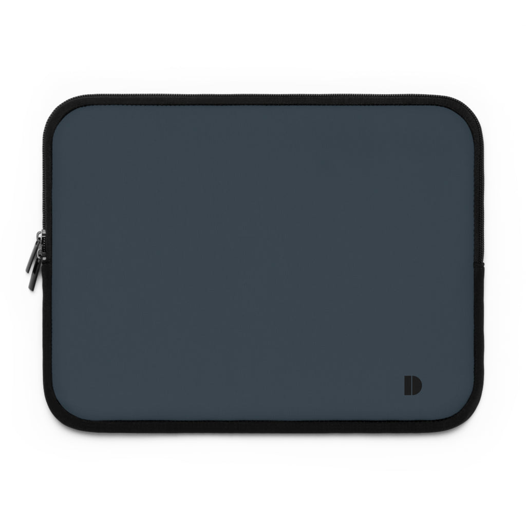 A dark slate blue laptop sleeve with black trim and a small black monogram logo in the bottom right corner, shown on a plain white background.