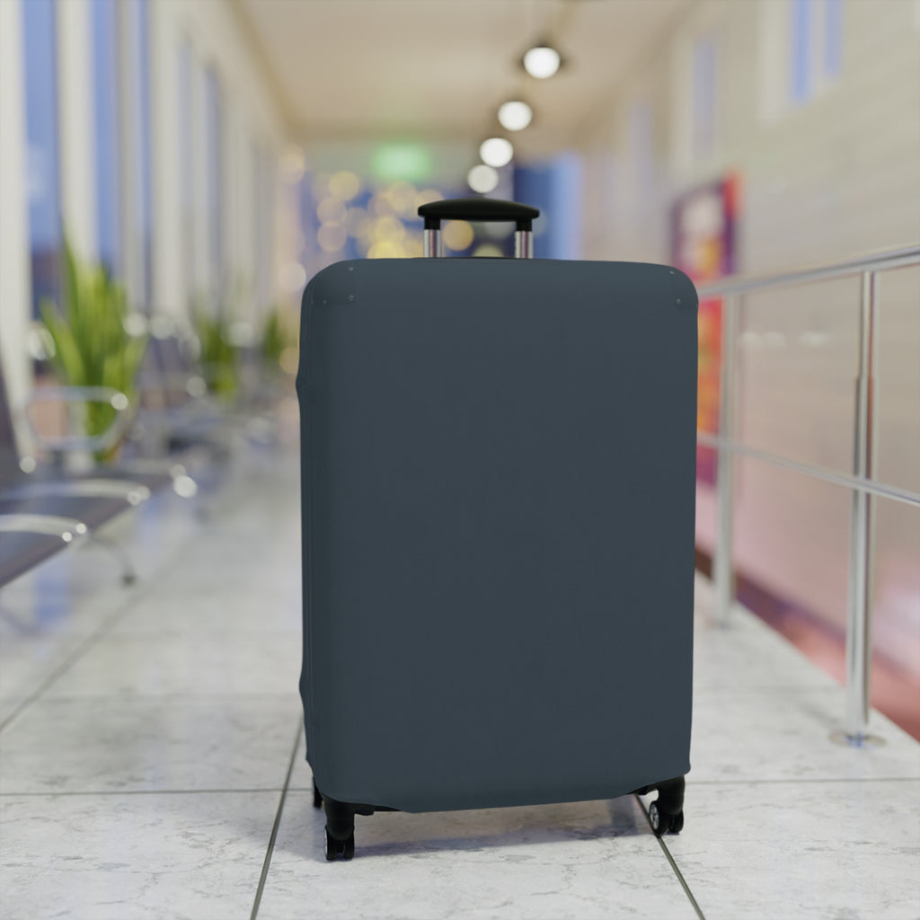 A dark slate blue or gray protective suitcase cover fitted on a rolling suitcase, standing in a blurred airport terminal hallway.