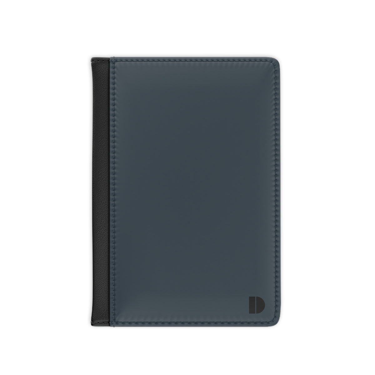 A slim, dark slate blue leather passport cover with a black side trim and a small black monogram logo in the bottom right corner, shown on a plain white background.