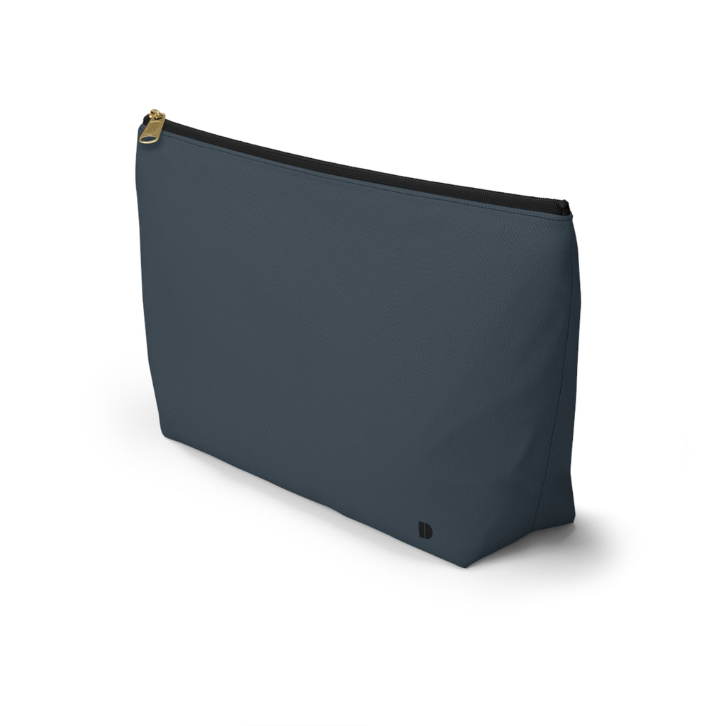 A dark slate blue zippered pouch with a gold zipper pull and a small black logo on the bottom right, shown against a plain white background.