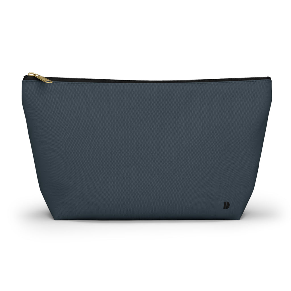 A dark slate blue zippered pouch with a gold zipper pull and a small black logo on the bottom right, shown against a plain white background.