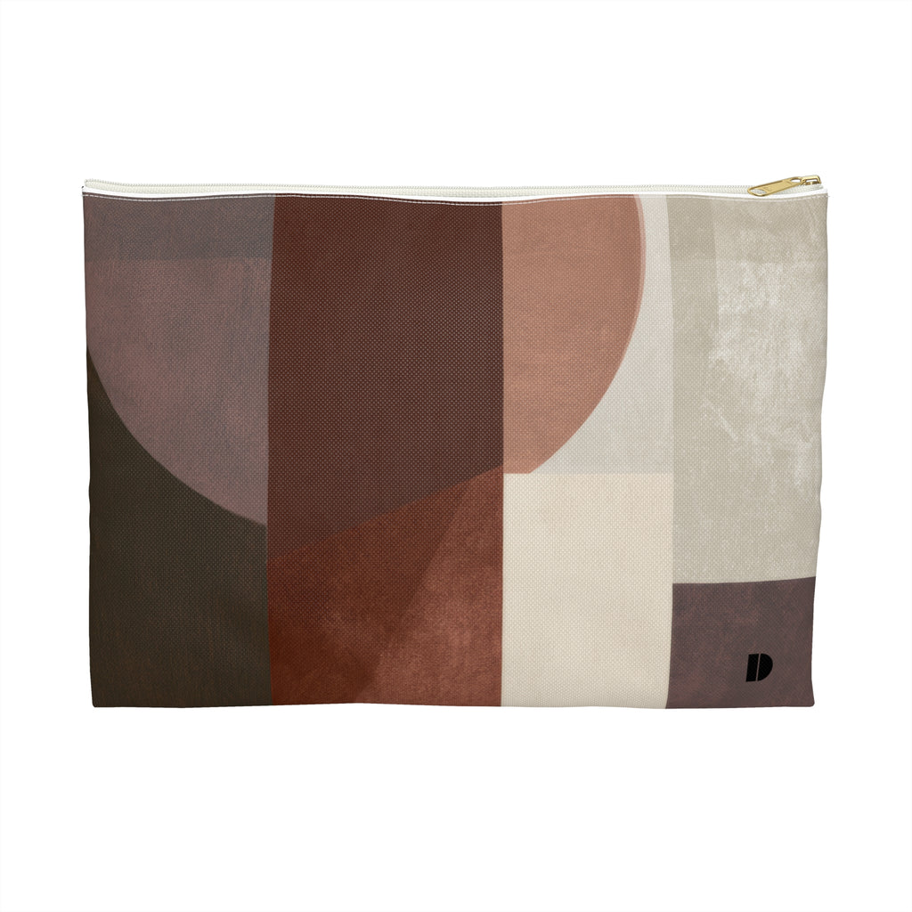 A rectangular zippered pouch with an abstract geometric print in earthy tones of brown, beige, and cream, featuring a small black monogram logo on the bottom right.