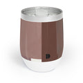 A 12 oz insulated stainless steel tumbler with a clear lid, featuring a color-blocked design in shades of brown and white with a small black monogram logo near the bottom.