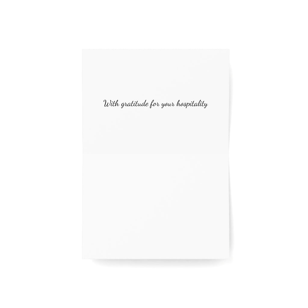 A minimalist white rectangular card interior with the phrase 'With gratitude for your hospitality' printed in small black script near the top, shown on a clean white background.