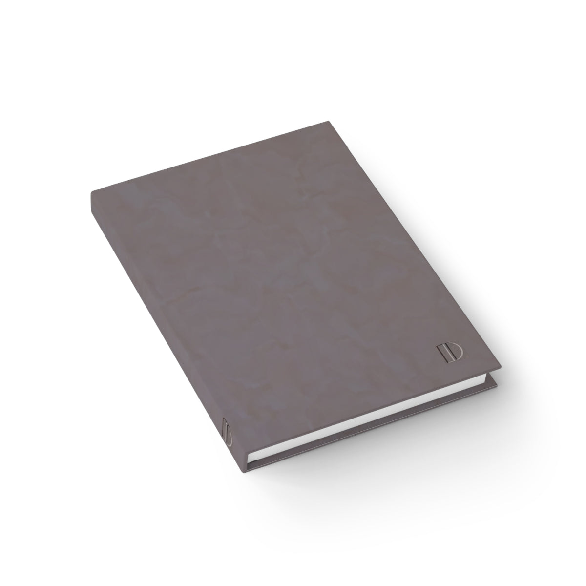 An angled overhead view of the mauve gray hardcover journal by The Cultivated Desk, showcasing the sturdy spine construction and high-quality paper book block.